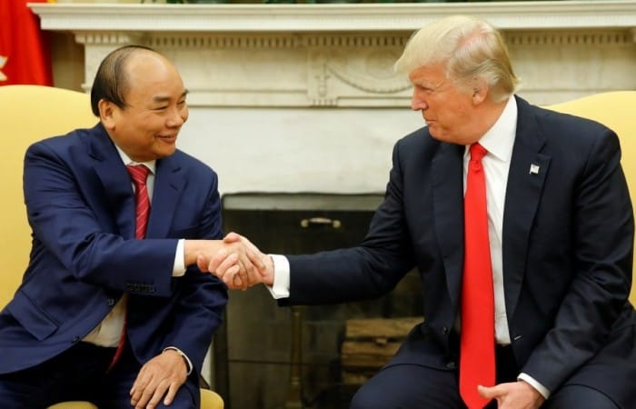 Trump in Vietnam says the US will no longer tolerate ‘chronic trade abuses’