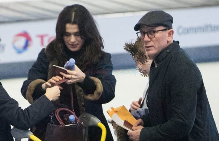 Daniel Craig carries Rachel Weisz’s bags as they arrive together at JFK airport