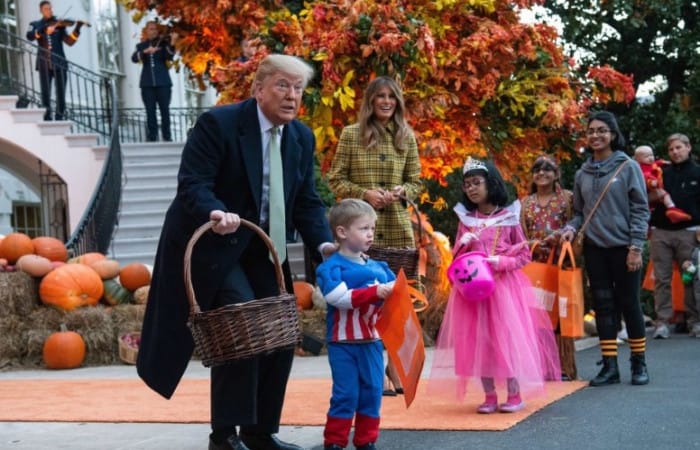 Melania Trump welcomes trick-or-treaters to the White House