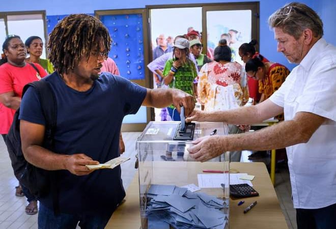 New Caledonians vote to stay French in tense referendum