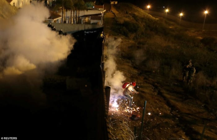 US authorities fire teargas across border to repel migrants from Central America