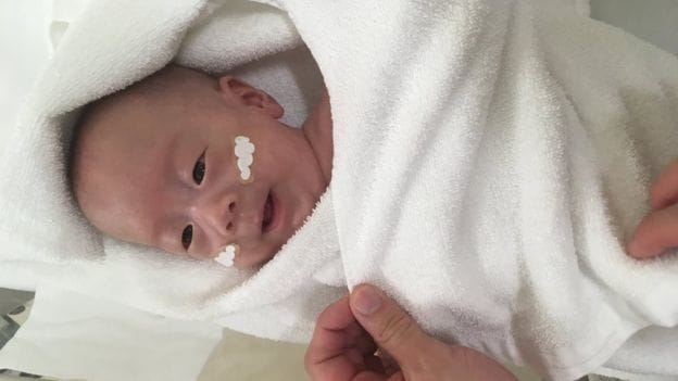 ‘Tiniest baby boy’ ever sent home leaves Tokyo hospital