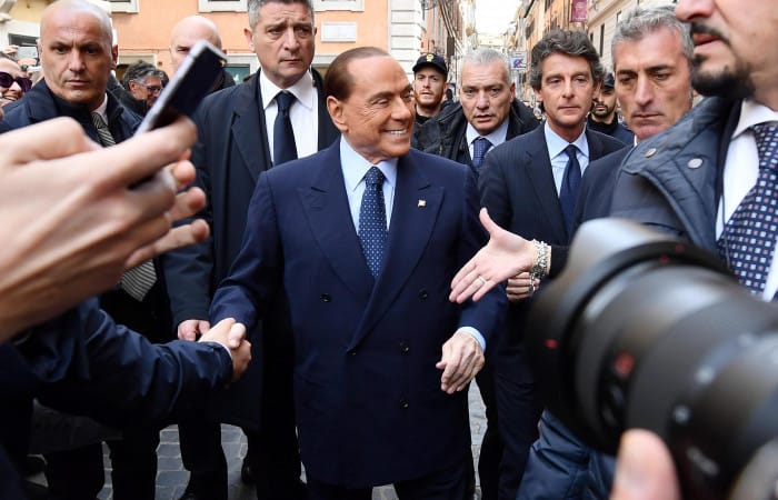 Silvio Berlusconi leaves hospital after op and vows to fight election