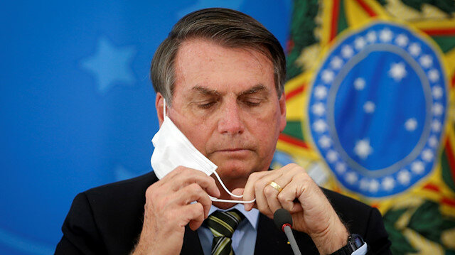 Brazil’s Bolsonaro removes mask in public after COVID recovery