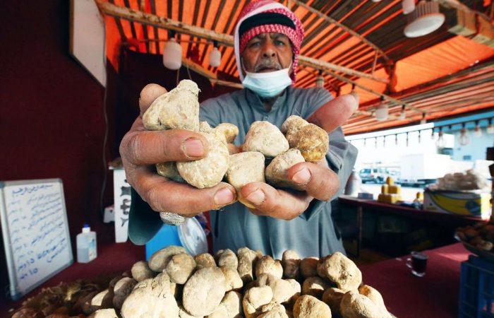 Kuwaiti market sellers entice shoppers with desert truffles