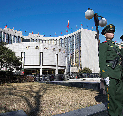 The People’s Bank of China lowered the yuan against the dollar to a two-year low.