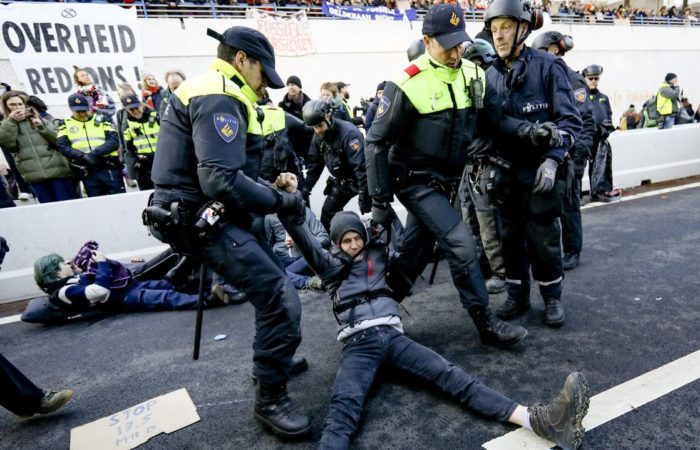 More than 700 climate protesters detained in The Hague.
