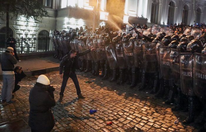 Georgian special forces fend off protesters in front of parliament with tear gas