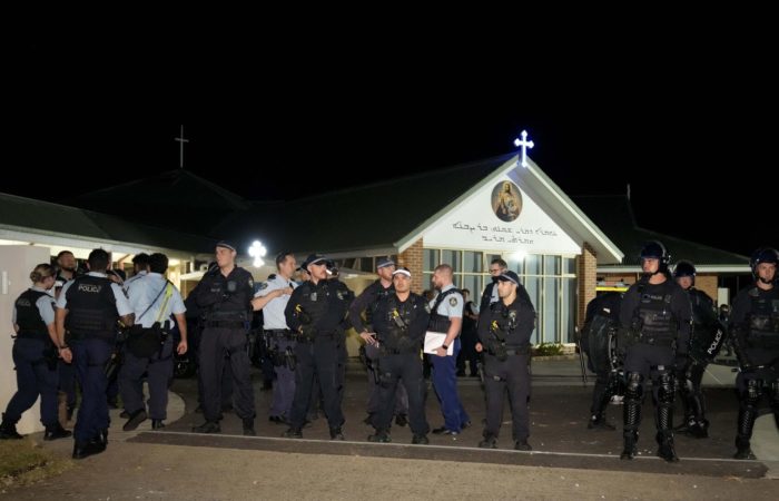 Riots broke out in Sydney after a priest was attacked in a church.